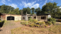 Bungalow mit Werkstattgebäude/Garage